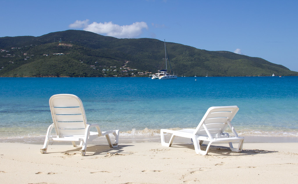White Lounge Chair On Tropical Beach