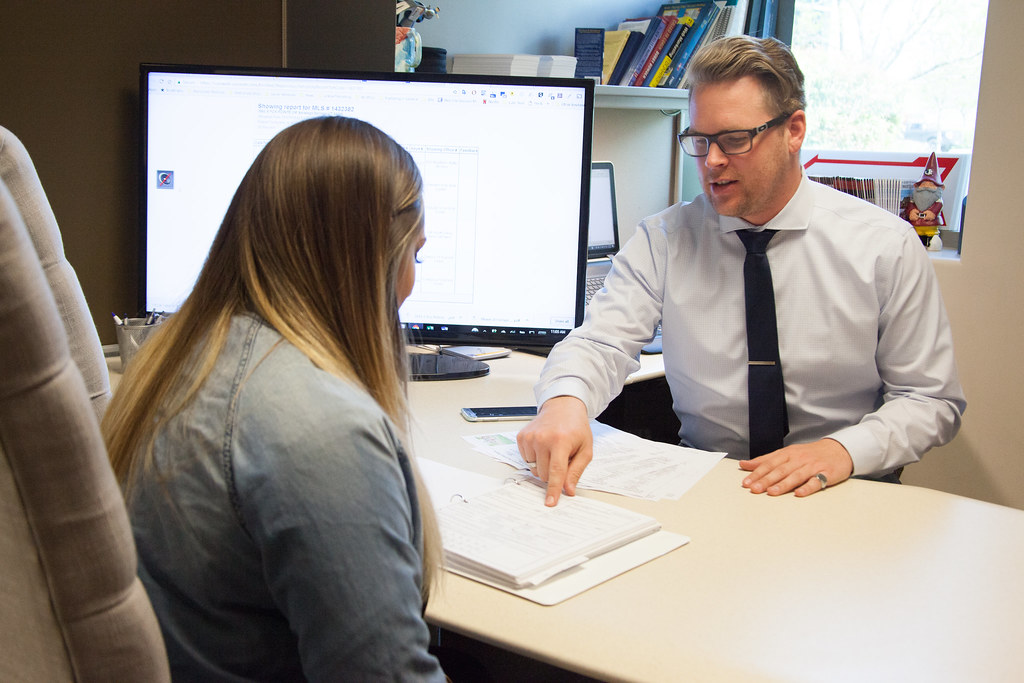 insurance claims adjuster meeting with a client