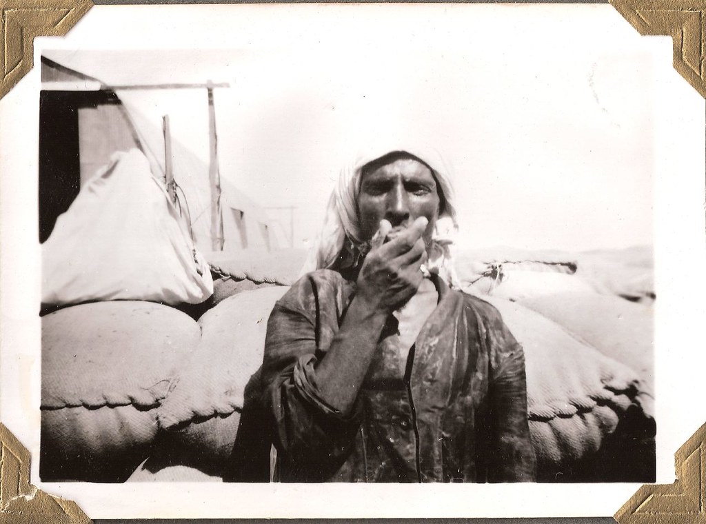 Warehouse worker in Kuwait...Arabian Gulf Region and Bechtel Construction; about 1950 عامل مخزن في الكويت... م